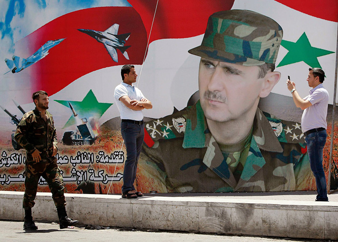 Портрет Башара Асада на плакате