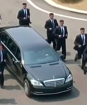 12 разогнанных мужчин: охрана, бегущая за лимузином Ким Чен Ына, взбаламутила Интернет (ВИДЕО)